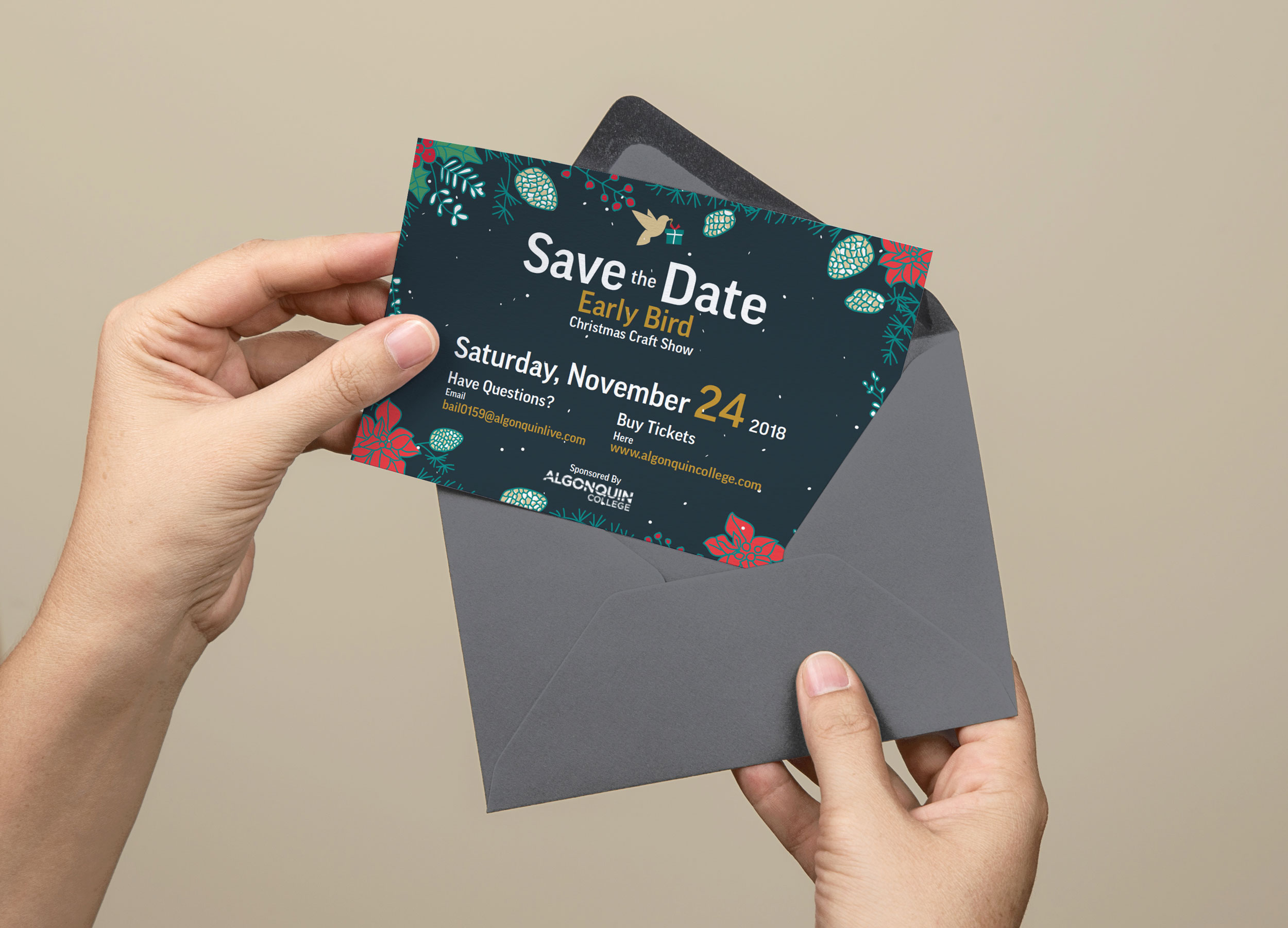 Someone pulling a save the date flyer for a Christmas craft show out of an envelope